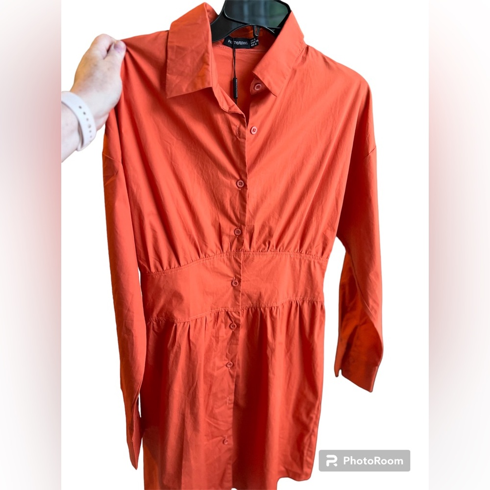 NWT Pretty Little Thing  Orange Dress size 4 US. Buttons up front. Long sleeves